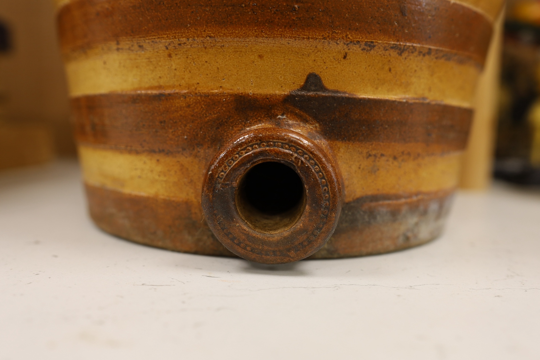 A Doulton and Watts stoneware spirit barrel, applied with the Royal coat of arms, 33.5cm high. Condition - some scratches in the glazing and marks on band by tap aperture